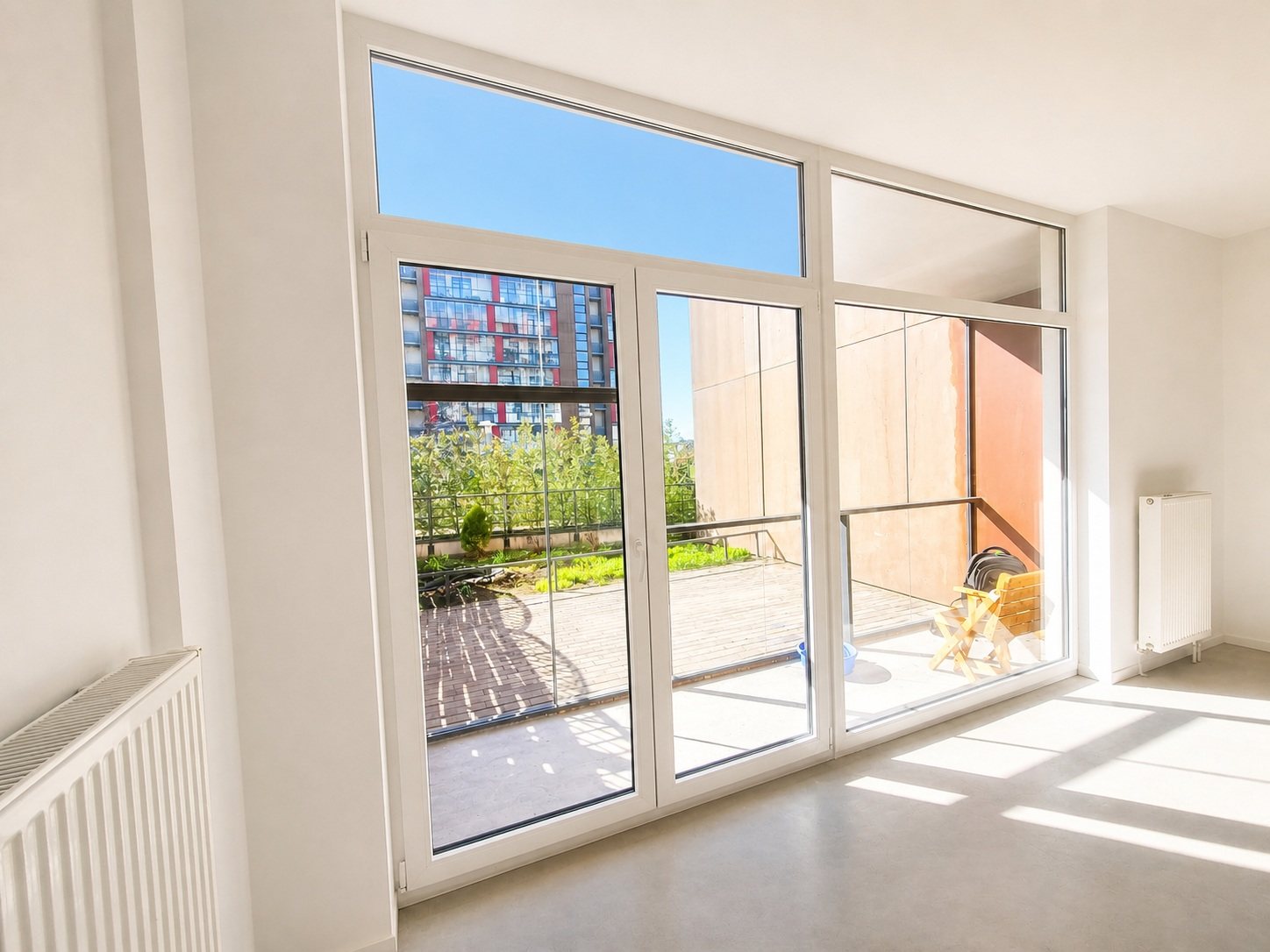 Panoramic windows and access to the loggia — Pūces birzs apartment, Purvciems, Riga