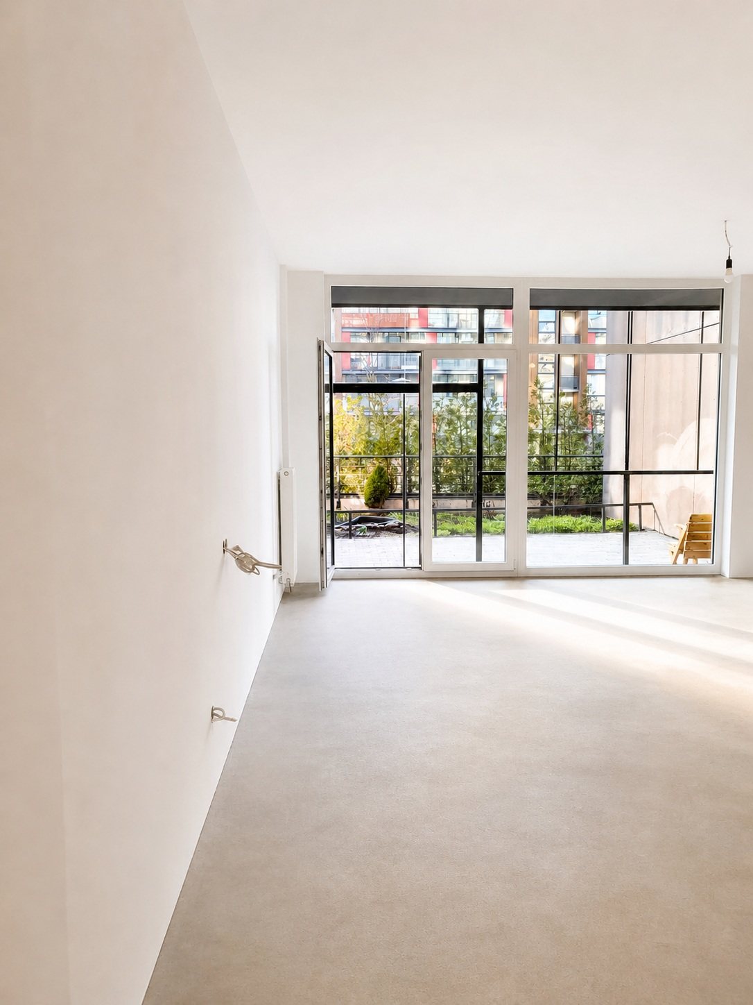 View from inside the apartment towards the windows — Pūces birzs apartment, Purvciems, Riga