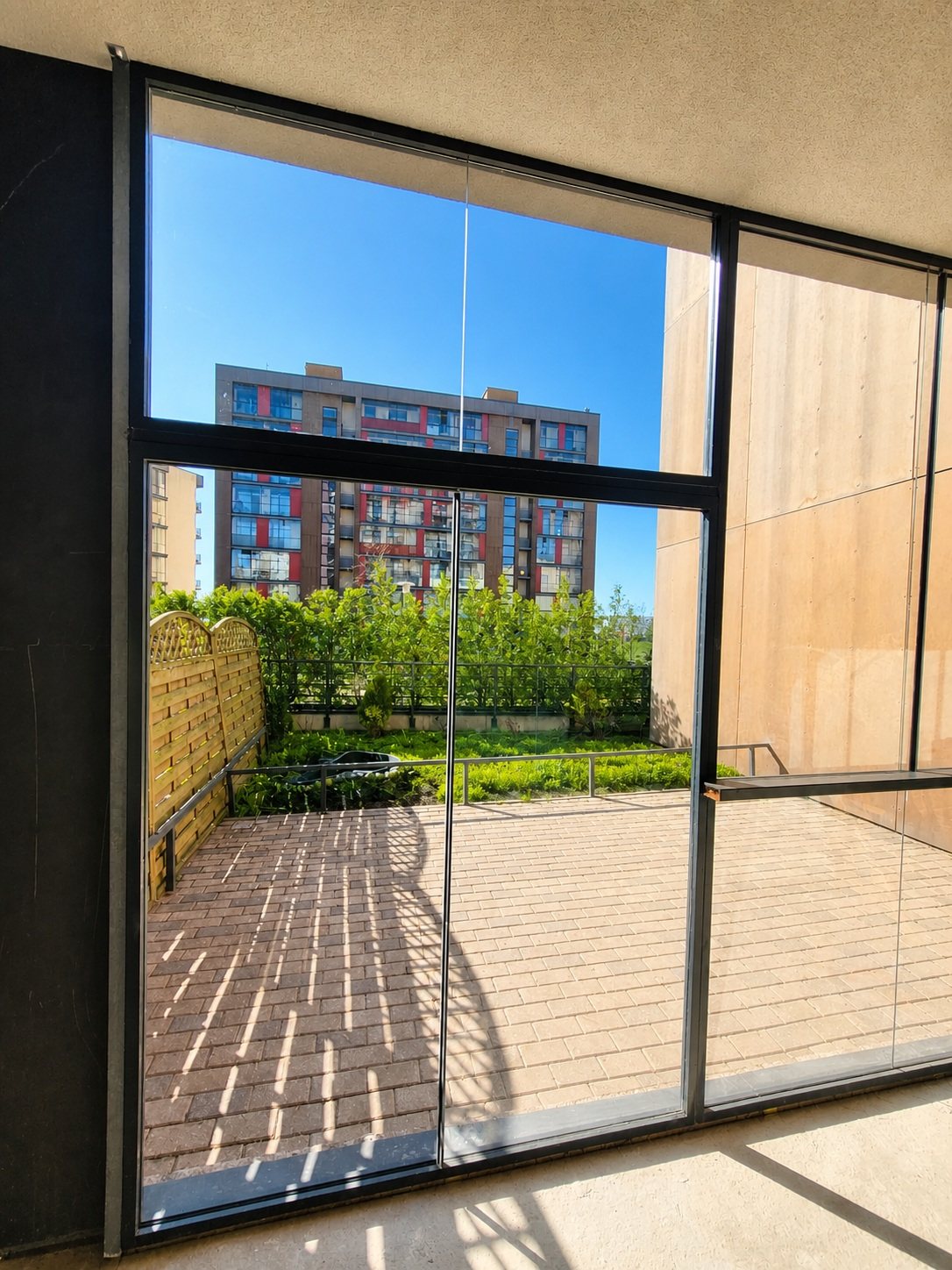 Loggia glazing viewed from inside — Pūces birzs apartment, Purvciems, Riga