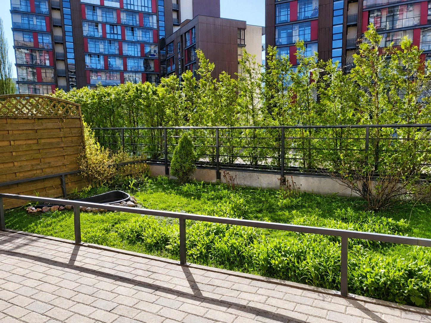 Living green area beside the apartment
