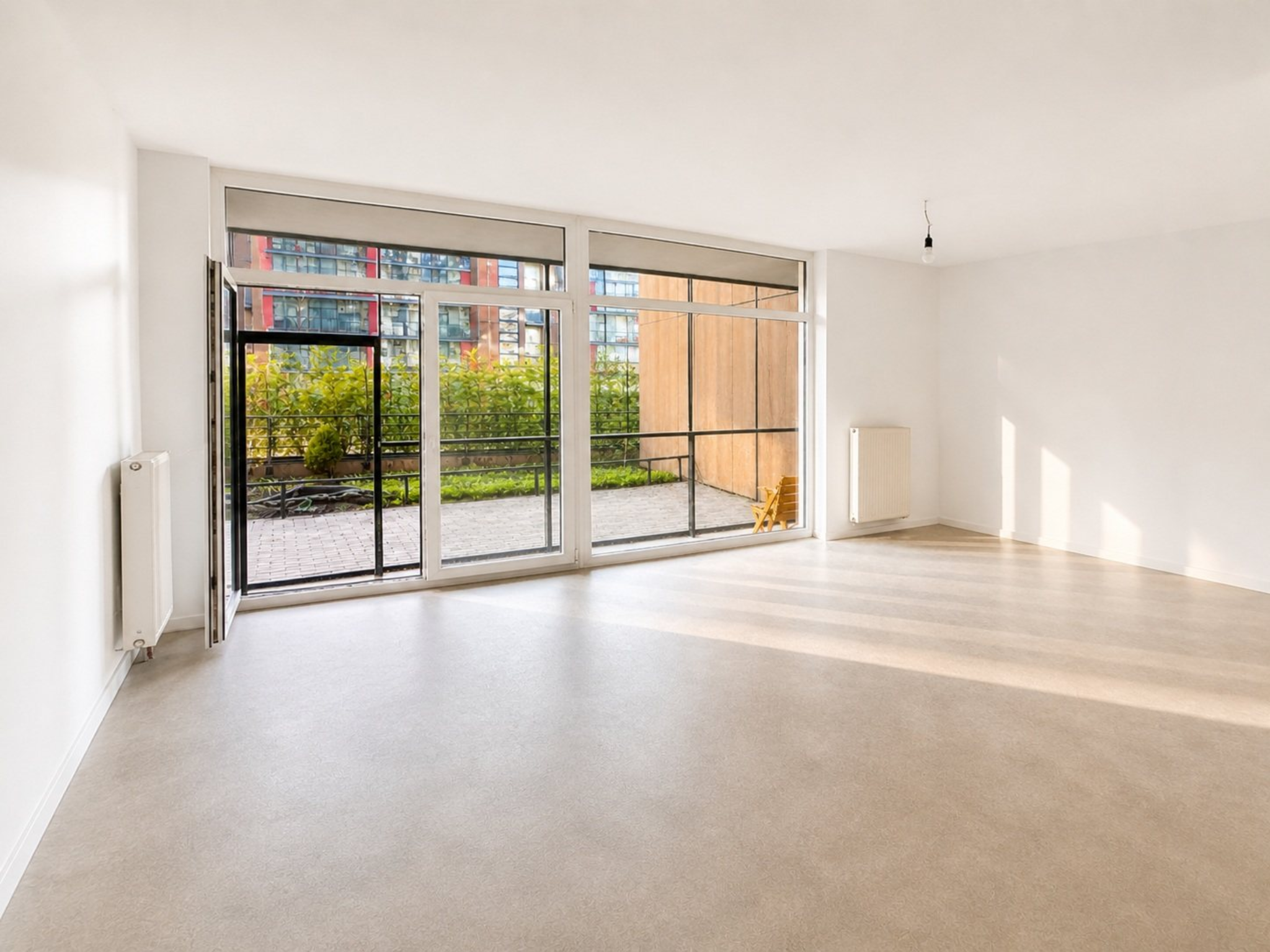 Spacious new room with panoramic glazing, a loggia and access to the terrace in the Pūces birzs apartment