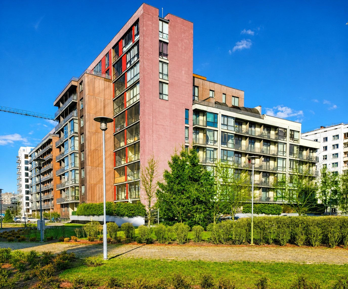 Building facade and green area — Pūces birzs apartment, Purvciems, Riga